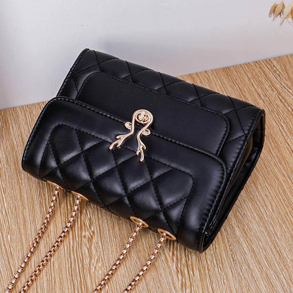 Black Shoulder Bag with Gold Accent Closure